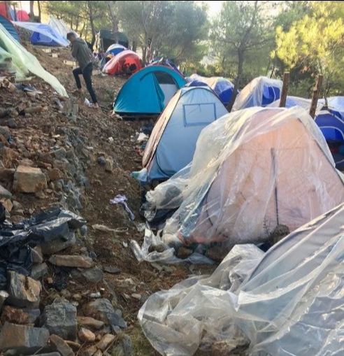 Tents perched on a rocky hill