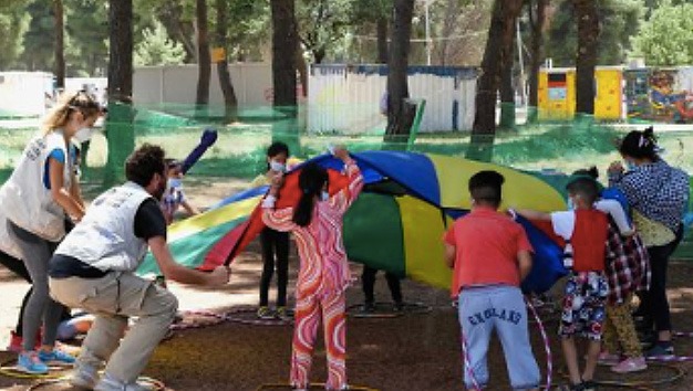 Children and volunteers playing outside